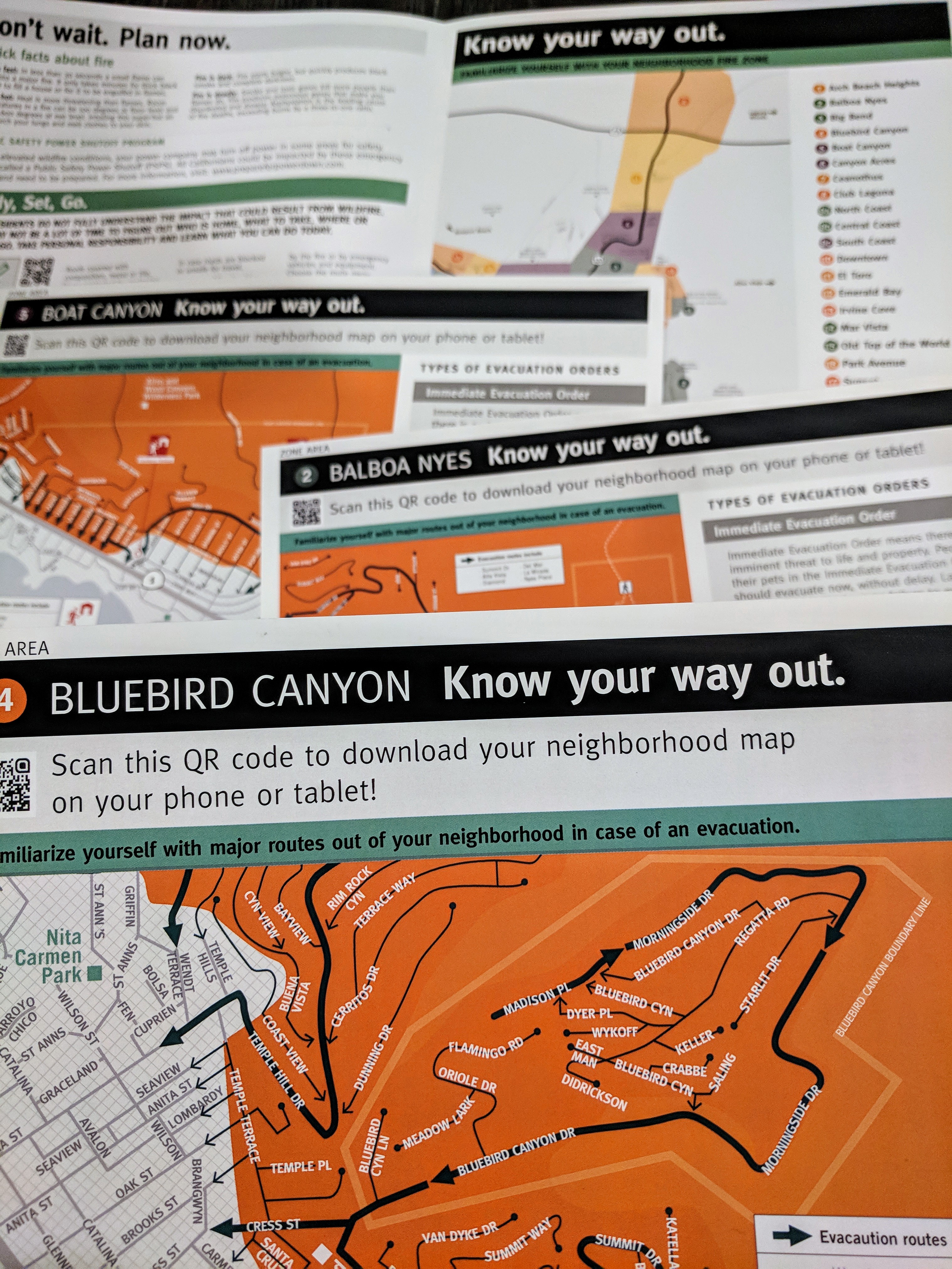 Several brochures for the City of Laguna Beach, Orange County,  showing fire zones produced as part of FireClear's Visual standards for public-facing rick-literacy maps. 